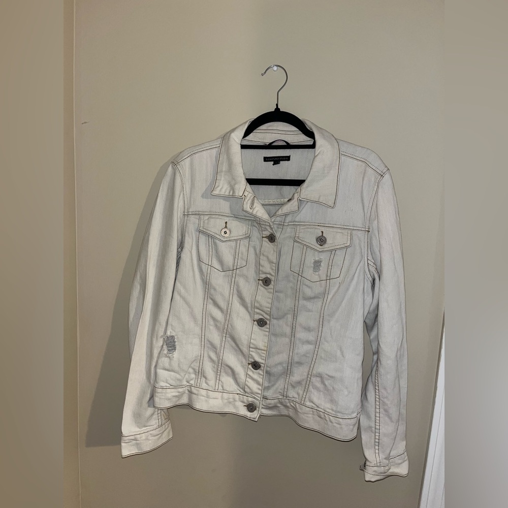 White jean jacket with rips
